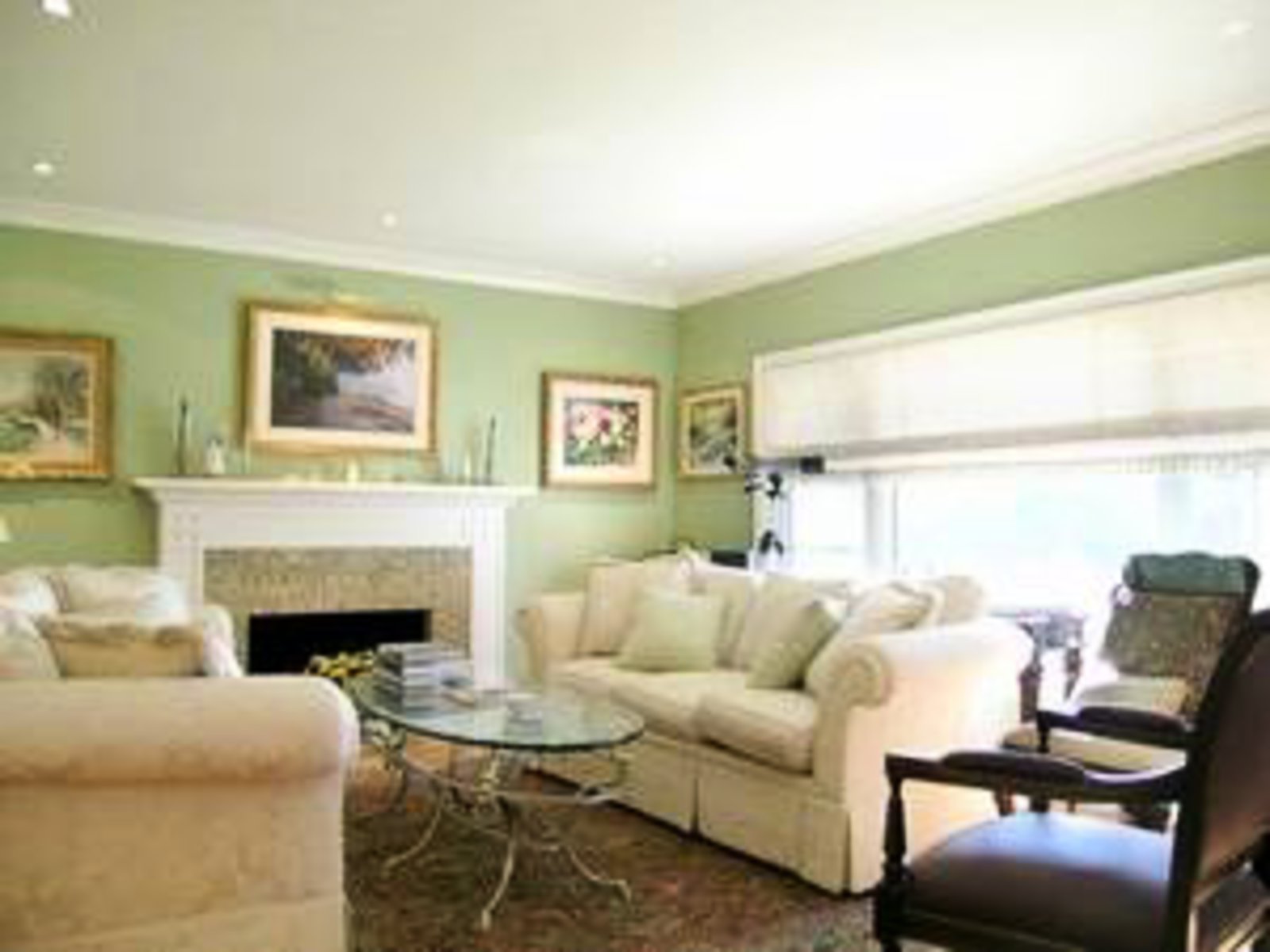Living Room Gas fireplace, hardwood floors, crown moldings, gas fireplace with custom granite mantle.