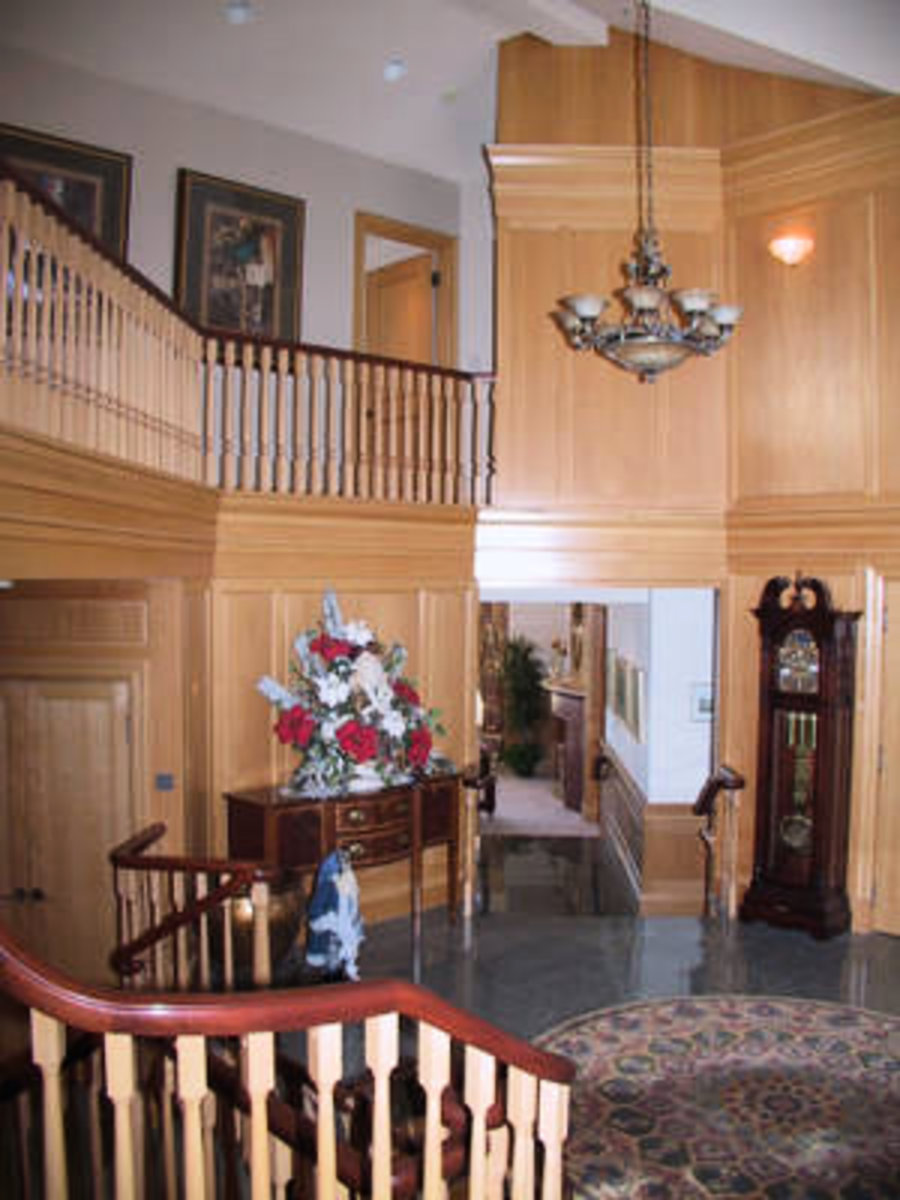 Foyer 2 storey ceiling, custom millwork, marble floor entrance.