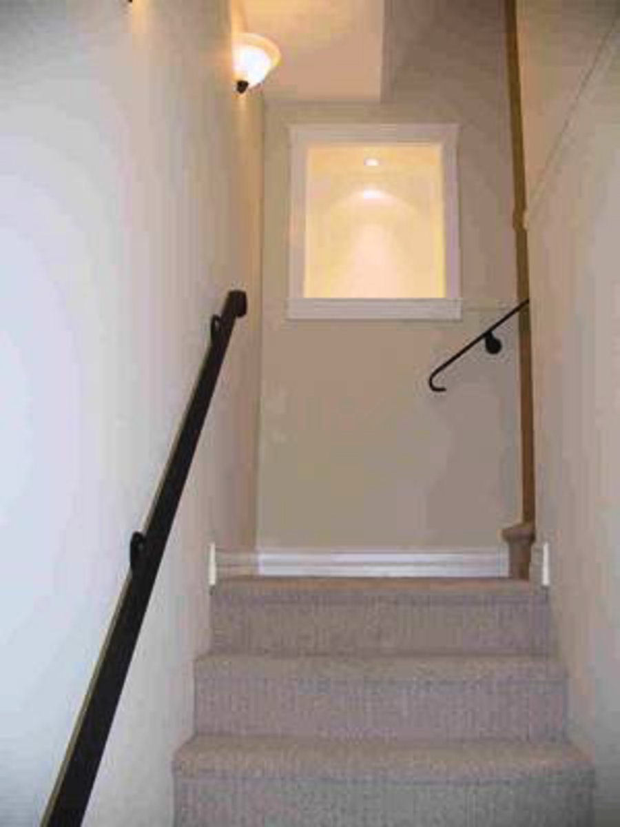 Stair case with lighted feature walls