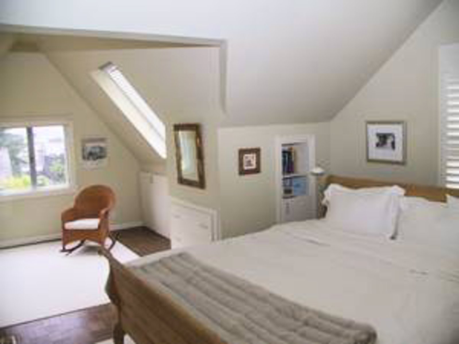 Master Bedroom Spacious master bedroom with separate sitting area with view of Lions Gate Bridge and Harbour.  Skylights, hardwood floors and built-in cabinetry