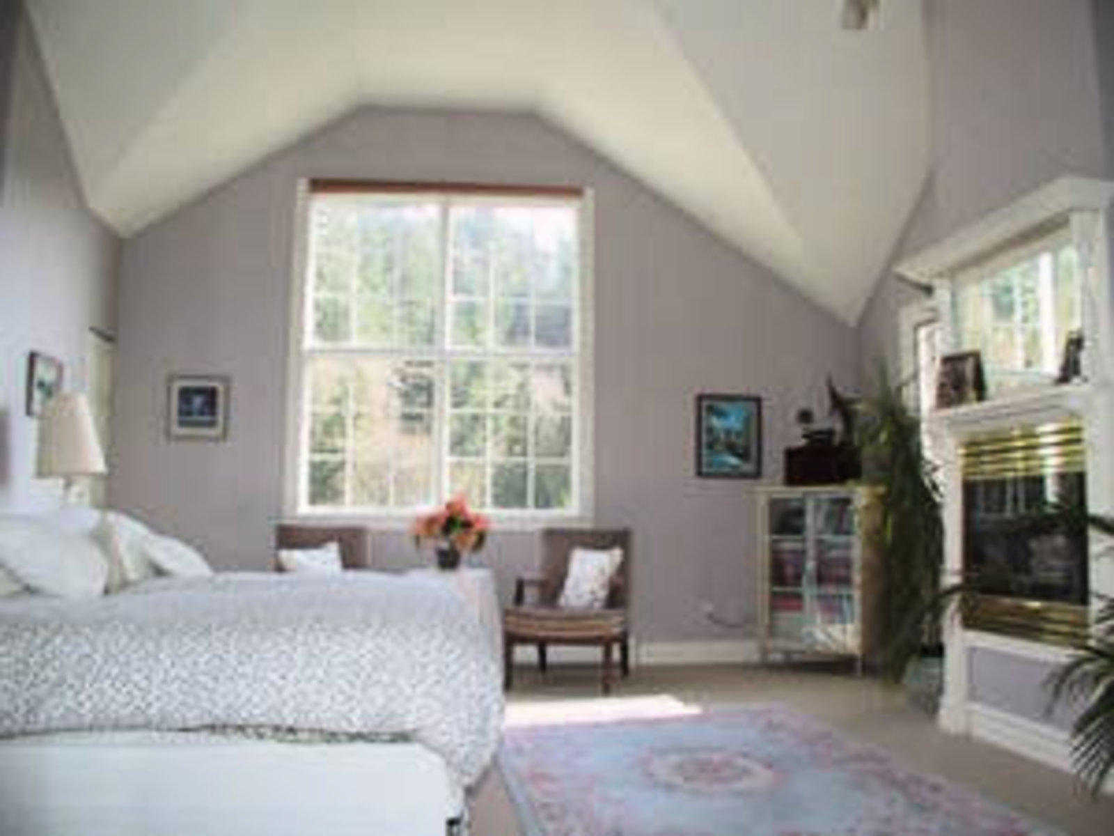 Master Bedroom French doors to private deck, vaulted ceilings, gas fireplace
